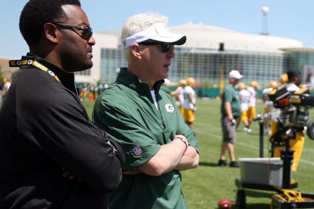 May 22, 2012; Green Bay, WI, USA; Green Bay Packers general manager Ted Thompson visits with Texas A&M head coach Kevin Sumlin during organized team activities at Ray Nitschke Field. Mandatory Credit: Mary Langenfeld-US PRESSWIRE