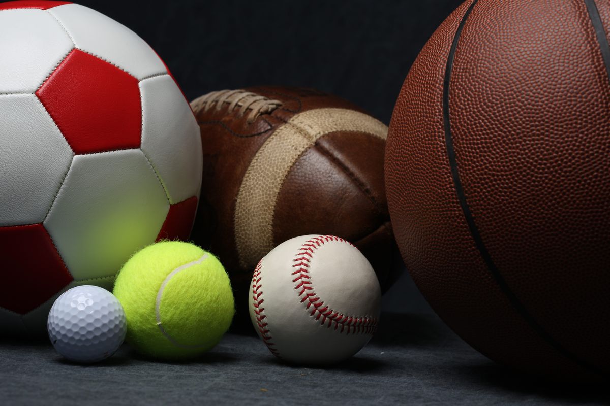 A studio shot of an assortment of sports ball.