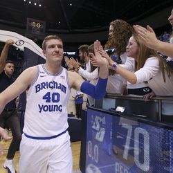 Brigham Young Cougars forward Kolby Lee (40) high-fives the students after the game against the San Diego Toreros in Provo on Thursday, Jan. 16, 2020. BYU won 93-70.