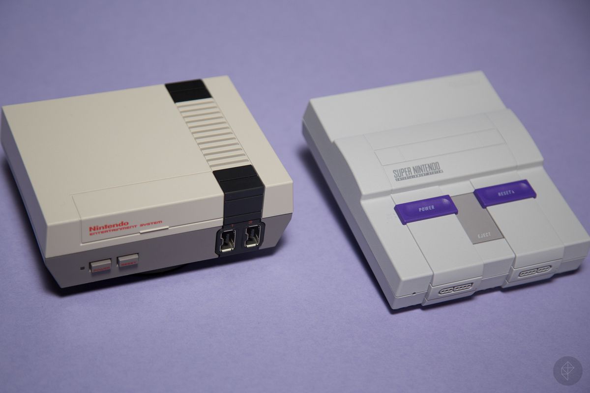 the NES Classic next to the SNES Classic, photographed on a purple background