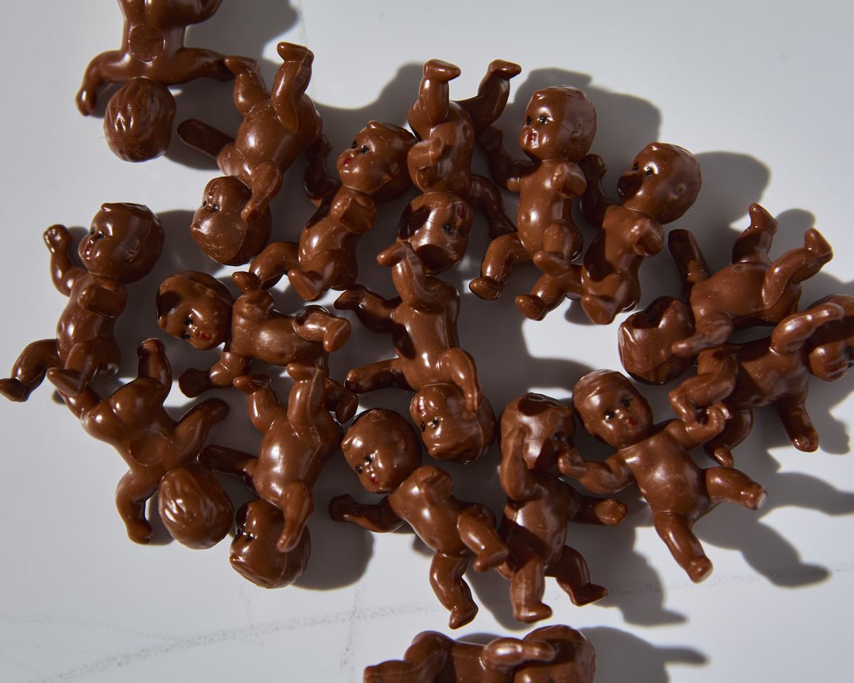 A pack of brown plastic babies.