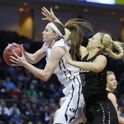Brigham Young Cougars forward Micaelee Orton (34) shoots by Santa Clara Broncos forward Marie Bertholdt (15) during the WCC tournament in Las Vegas Monday, March 7, 2016. BYU won 87-67.