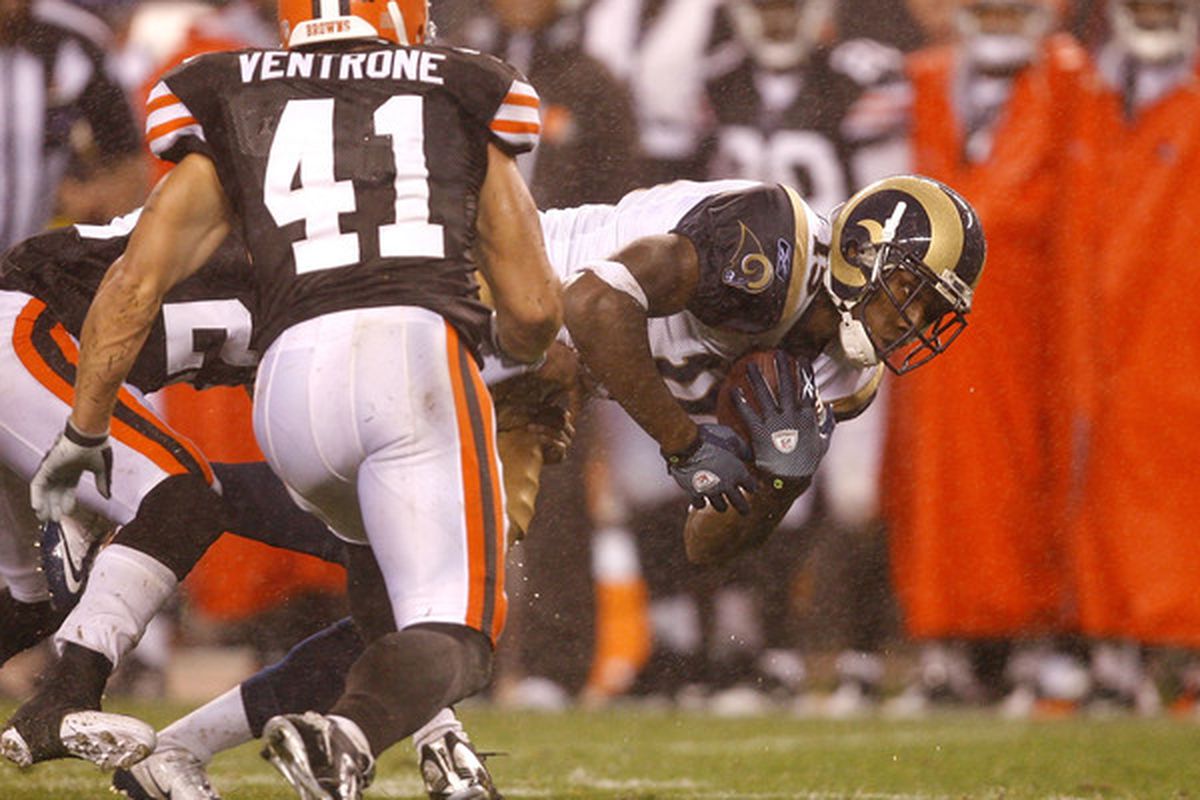 CLEVELAND - AUGUST 21:  Dominique Curry #15 of the St. Louis Rams dives for yardage as he is hit by Ray Ventrone #41 of the Cleveland Browns at Cleveland Browns Stadium on August 21 2010 in Cleveland Ohio.  (Photo by Matt Sullivan/Getty Images)