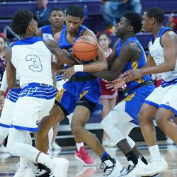 Simeon’s Andre Casey Jr. (23) and Ahamad Byunm (12) try to hold on to the ball against Curie, Tuesday 03-11-19. Worsom Robinson/For the Sun-Times.