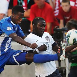 Honduras' Jose Valasquez (5) kicks the ball away from Jozy Altidore (17) of the U.S. as the United States and Honduras play Tuesday, June 18, 2013 at Rio Tinto Stadium.