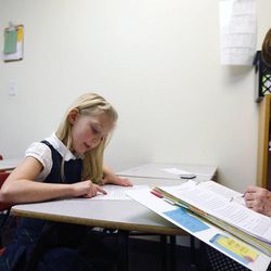 Ruby Sonntag takes a reading comprehension test with teacher Joanne Parrish at Legacy Preparatory Academy in North Salt Lake City Tuesday, Feb. 24, 2015.
