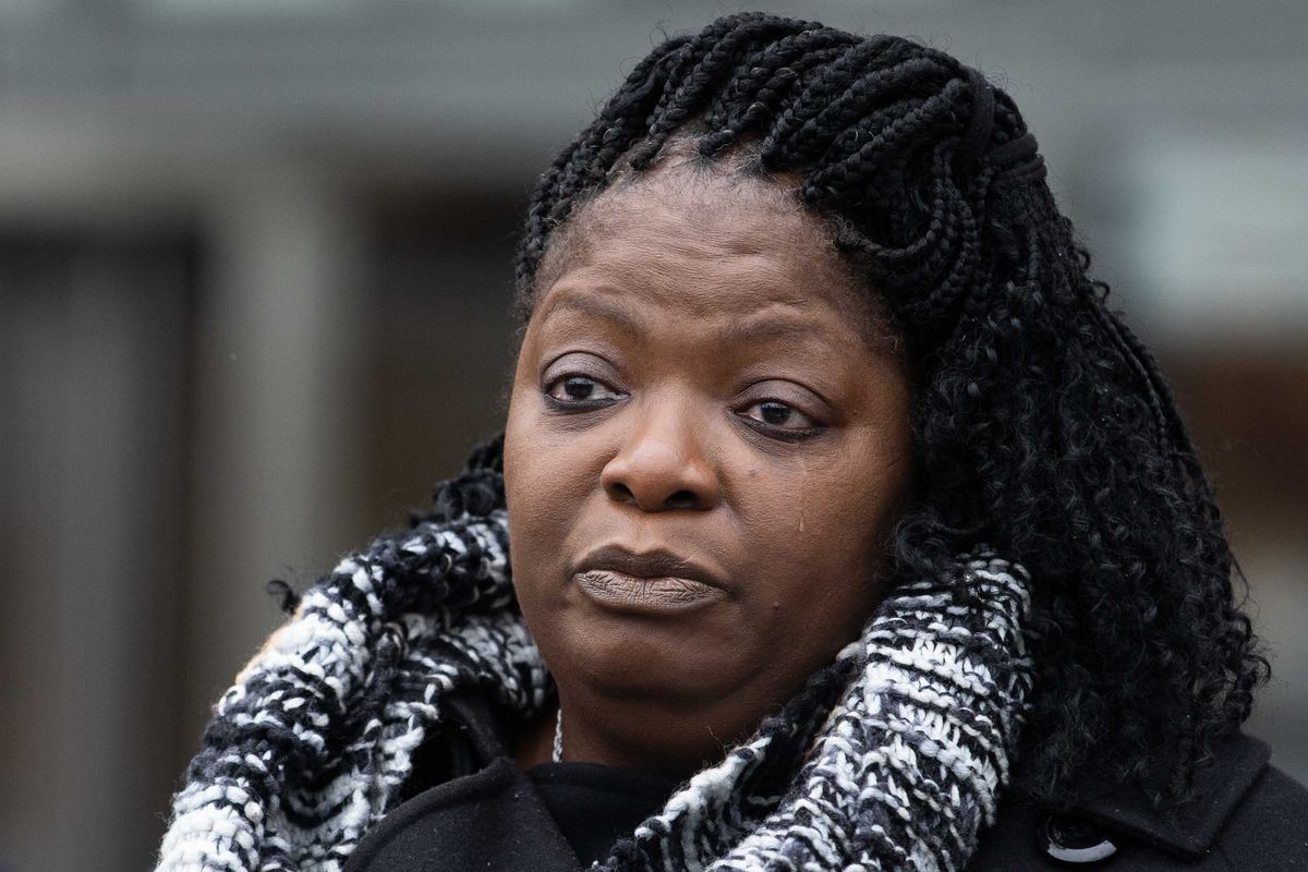 Anjanette Young, who was a victim of a botched raid by the Chicago Police Department in 2019, tears up as she speaks to the press outside the Chicago Police Department headquarters, Wednesday afternoon, Dec. 16, 2020.