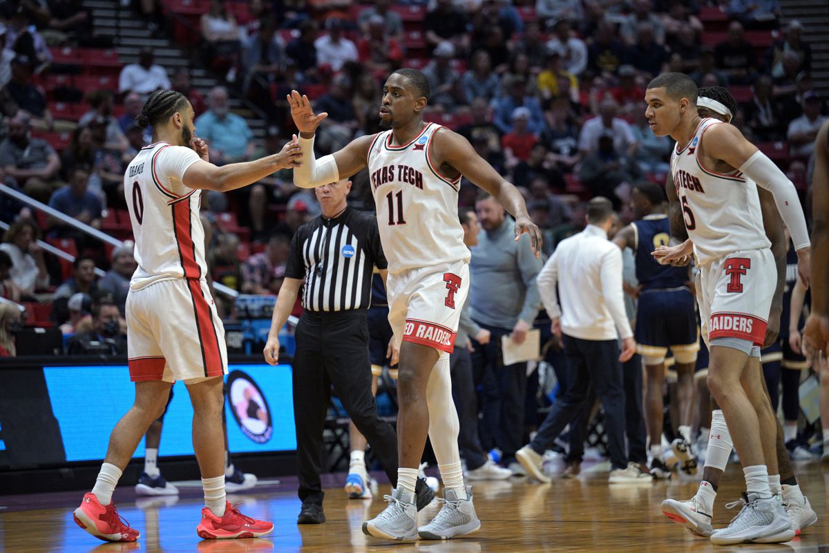 Texas Tech Red Raiders forward Kevin Obanor (0) and forward Bryson Williams (11) and guard Kevin McCullar (15) react in the second half against the Montana State Bobcats during the first round of the 2022 NCAA Tournament at Viejas Arena.