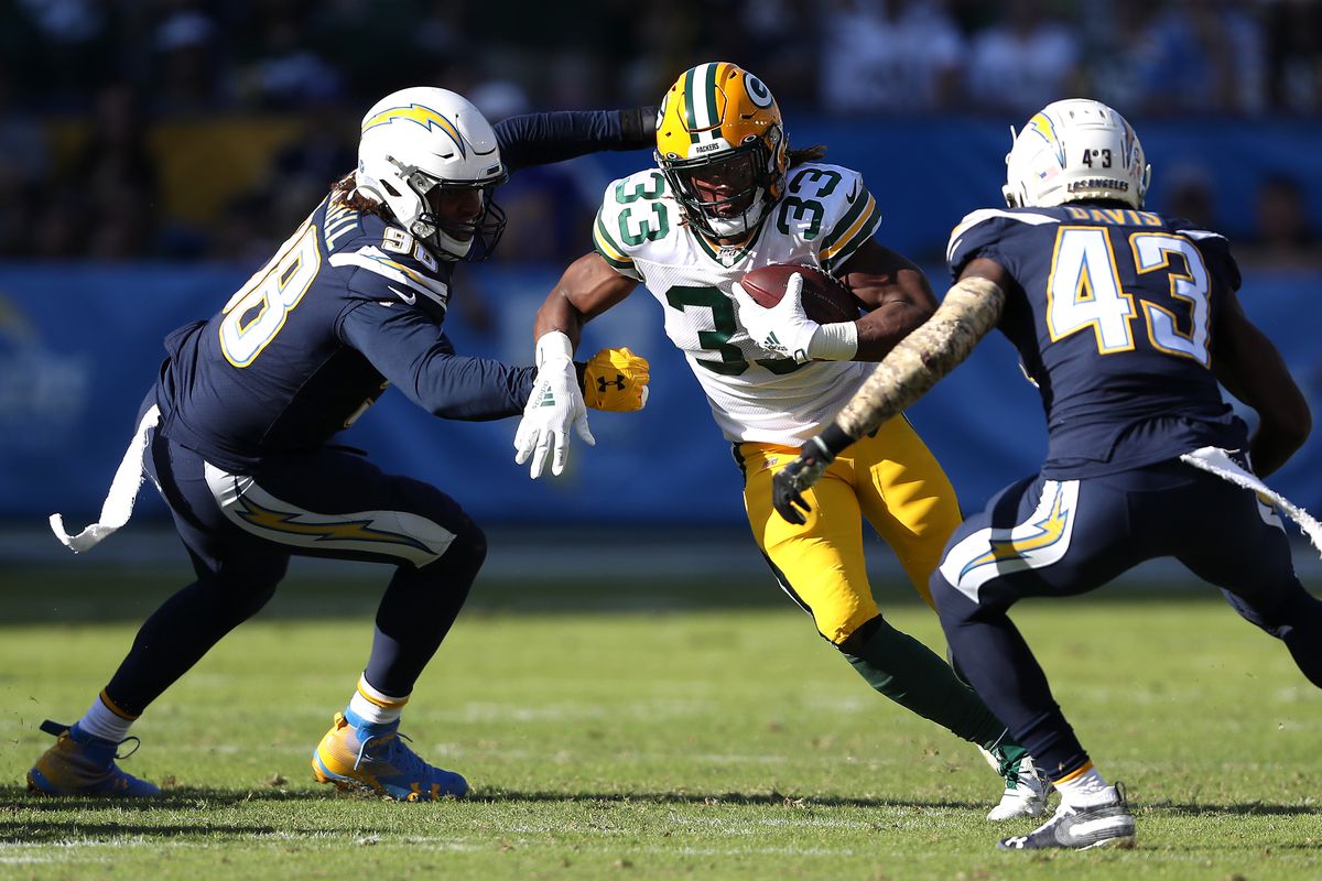 Aaron Jones of the Green Bay Packers runs with the ball during the first half against the Los Angeles Chargers at Dignity Health Sports Park on November 03, 2019 in Carson, California.