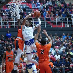 Curie’s Ramean Hinton (23) is found by Young’s Sangolay Njie (1), Friday 03-08-19. Worsom Robinson/For the Sun-Times.
