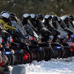 The motorcade lines up at the Ogden Cemetery for the graveside service of Ogden officer Jared Francom in Ogden Wednesday, January 11, 2012. Francom and five others were injured during a routine drug raid last week.