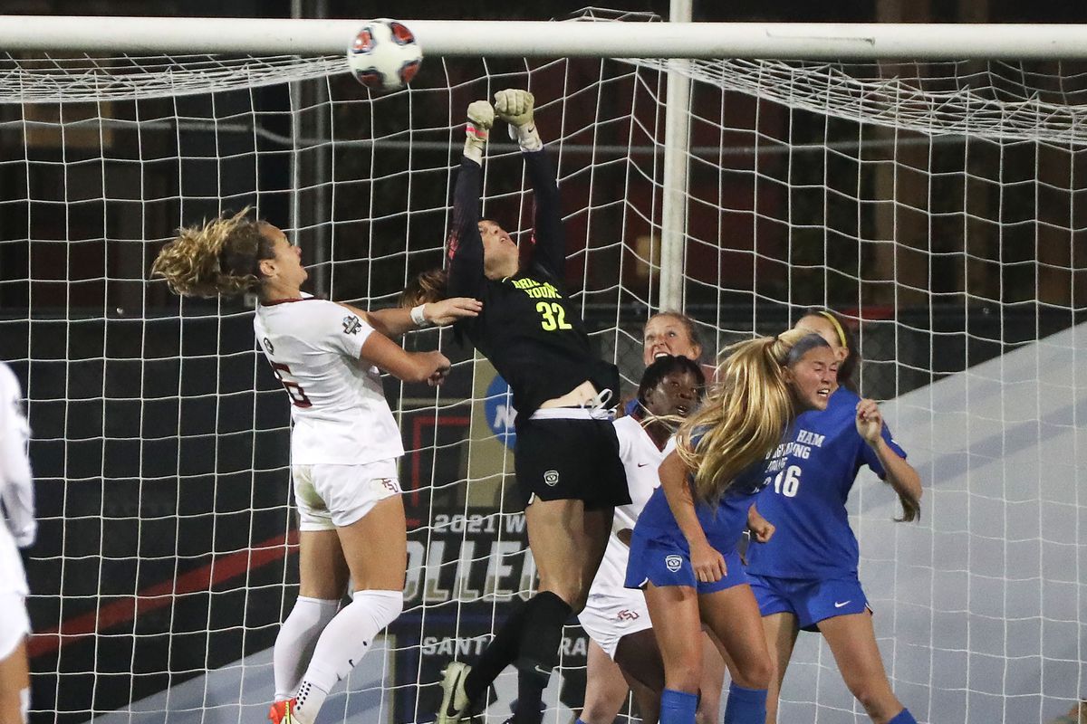 Brigham Young Cougars goalkeeper Cassidy Smith  jumps to make a save