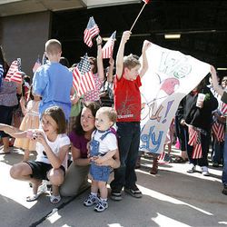 Family members and friends wait for the arrival of more than 200 airmen in the 34th Fighter Squadron and the 34th Aircraft Maintenance Unit at Hill Air Force Base after the airmen returned home Friday from Bagram Air Base in Afghanistan.