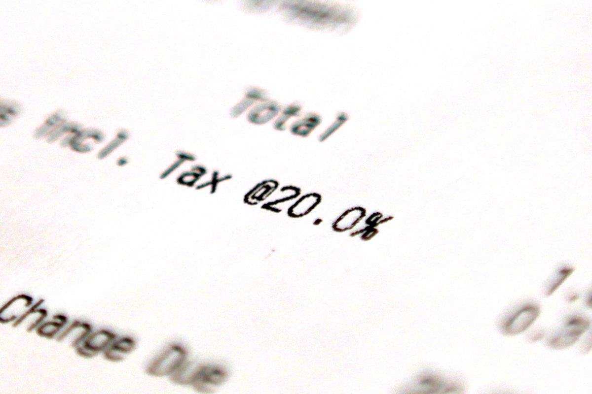 A close-up photo of a U.K. receipt, focussed on the line mentioning VAT, listed at 20 percent.