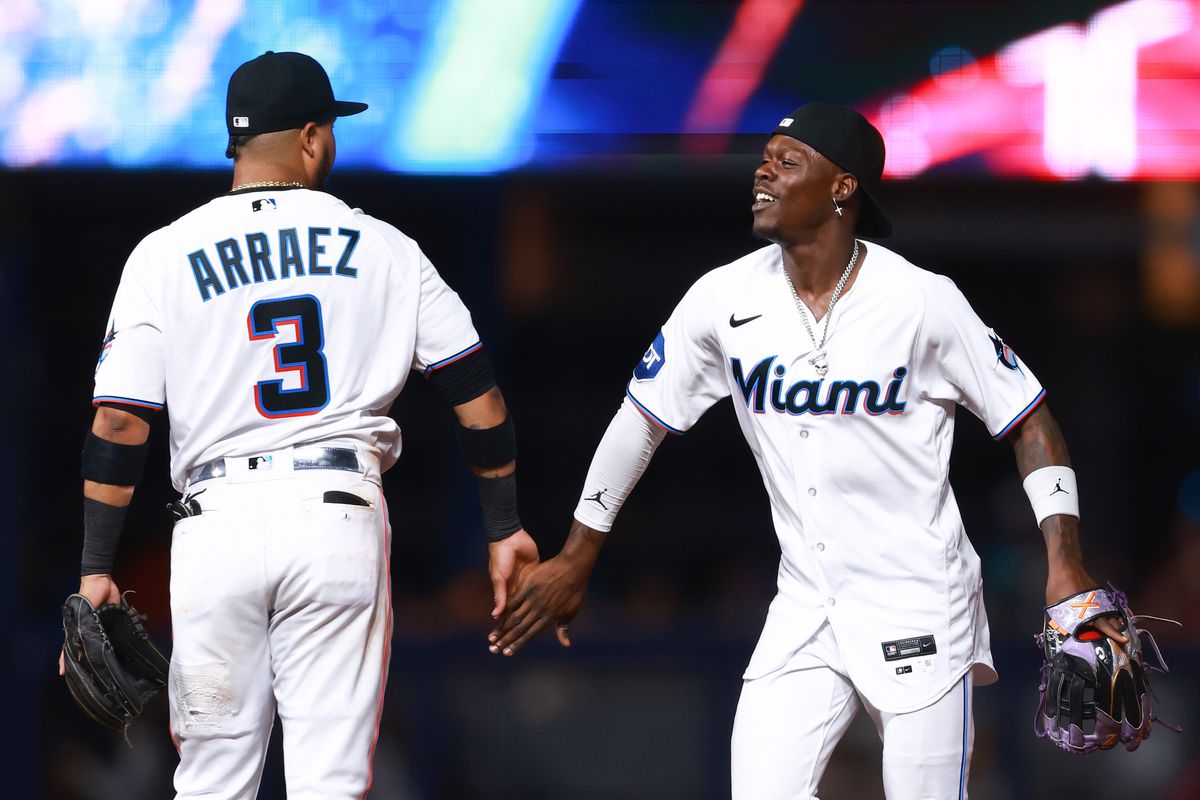 Luis Arraez and Jazz Chisholm Jr. of the Miami Marlins celebrate after defeating the Houston Astros at loanDepot park on August 14, 2023 in Miami, Florida.