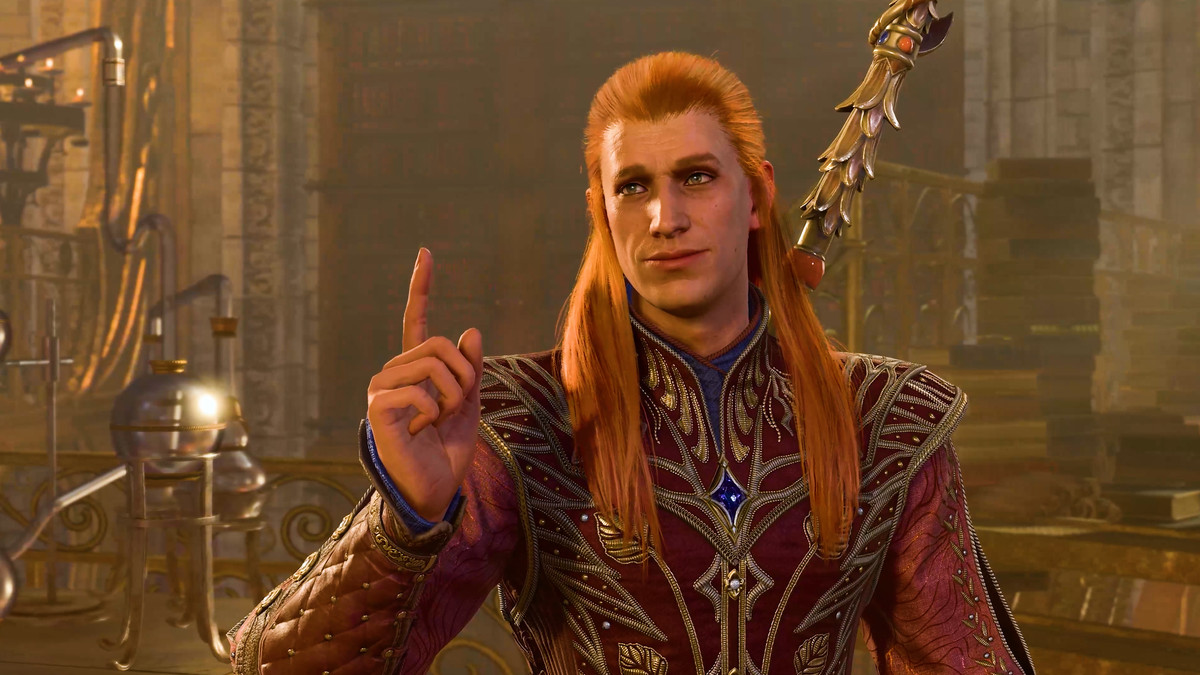 A sorcerer with a mullet of ginger hair holds up a finger, as if expressing an important opinion
