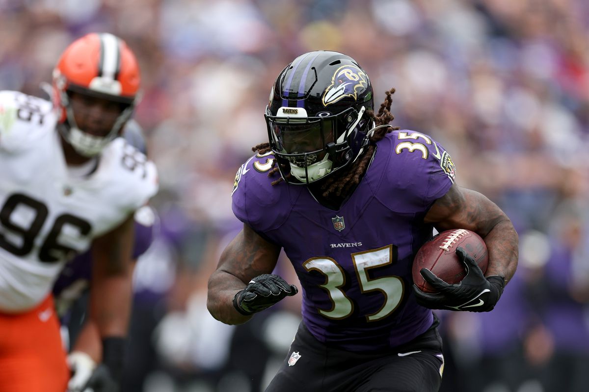 Running back Gus Edwards #35 of the Baltimore Ravens runs for a first half touchdown against the Cleveland Browns at M&amp;T Bank Stadium on October 23, 2022 in Baltimore, Maryland.