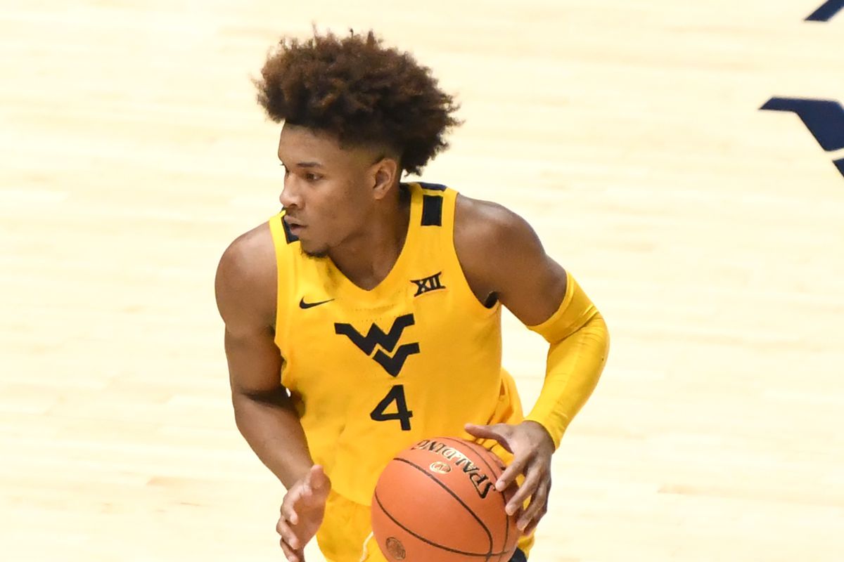 Miles McBride #4 of the West Virginia Mountaineers dribbles the ball during a college basketball game against the Baylor Bears at WVU Coliseum on March 2, 2021 in Morgantown, West Virginia.