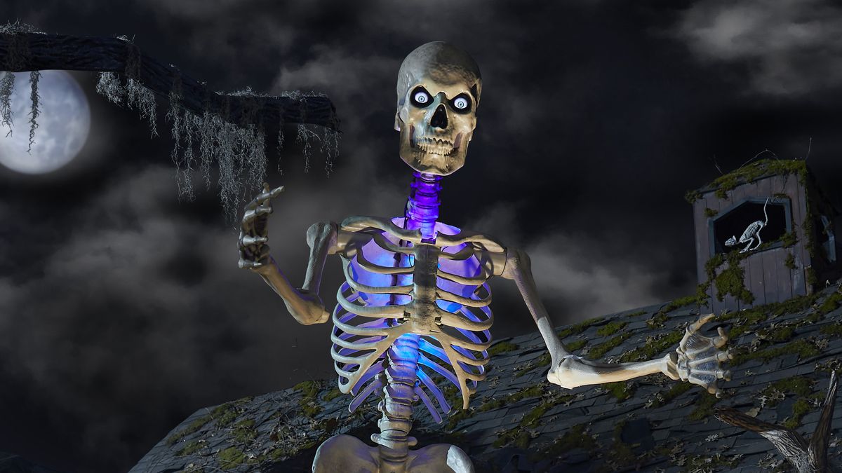 An image of a 12-foot-tall skeleton home decoration sold by Home Depot. Fans call him Skelly and he looms on with digital LCD eyes.