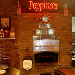 <b>Peppino's</b>: This Brooklyn pizzeria has a neon sign  at the top -- incredibly rare, even for ovens with names on them. What's more, the other design elements -- the glass bricks, the garlic wreaths -- are all arranged to emphasize that glowing stunne