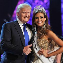 From left, Donald Trump and Miss Connecticut USA Erin Brady pose onstage after Brady won the 2013 Miss USA pageant, Sunday, June 16, 2013, in Las Vegas. (AP Photo/Jeff Bottari)