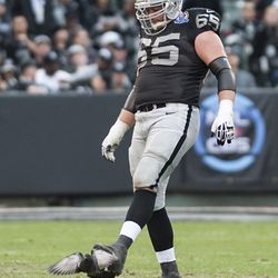 Dec 16, 2012; Oakland, CA, USA; Oakland Raiders guard Mike Brisiel (65) kicks a pigeon during a timeout in the game against the Kansas City Chiefs at O.co Coliseum.
