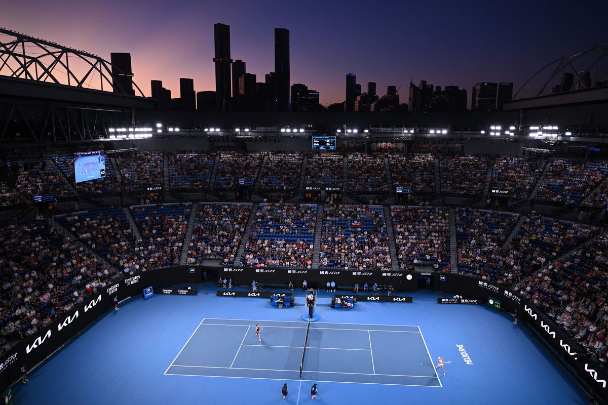 This picture shows a general view at sunset of the Rod Laver Arena during the women’s singles match between Poland’s Iga Swiatek and Germany’s Jule Niemeier on day one of the Australian Open tennis tournament in Melbourne on January 16, 2023.