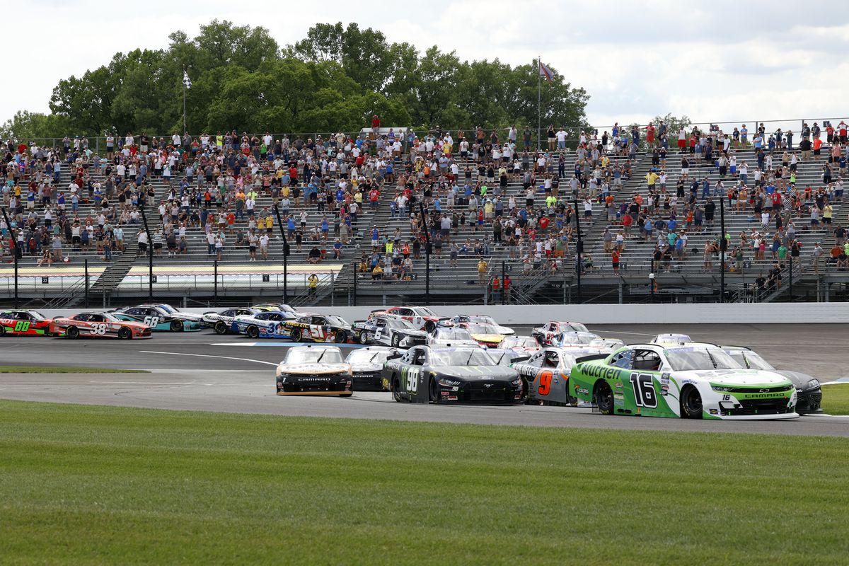 NASCAR Xfinity series driver AJ Allmendinger (16) leads the start of the race going into turn 2 during the Pennzoil 150 at the Brickyard on July 30, 2022 at the Indianapolis Motor Speedway Road Course in Indianapolis, Indiana.