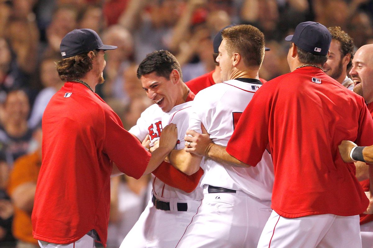 BOSTON, MA - AUGUST 3:  Jacoby Ellsbury #2 of the Boston Red Sox celebrates his game-winning home run in the ninth inning against the Cleveland Indians at Fenway Park on August 3, 2011 in Boston, Massachusetts.  (Photo by Jim Rogash/Getty Images)