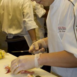 Social House executive chef John Chien Lee slices Alaskan King crab for the inside of the Ultimate Roll.
