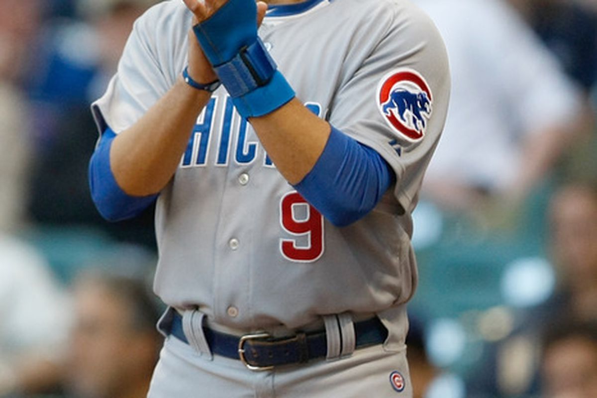 David DeJesus of the Chicago Cubs claps after scoring against the Milwaukee Brewers at Miller Park on June 5, 2012 in Milwaukee, Wisconsin. (Photo by Scott Boehm/Getty Images)