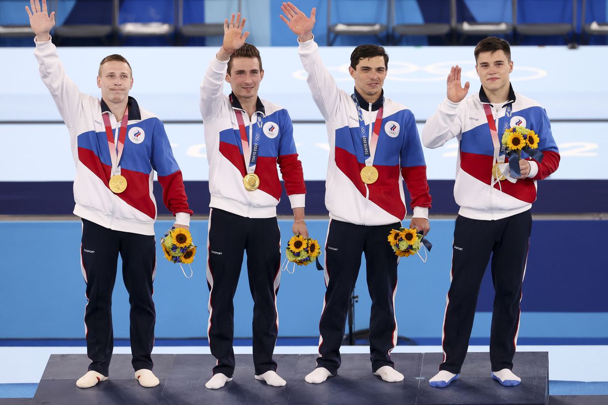 Gold medalists Denis Abliazin, David Belyavskiy, Artur Dalaloyan and Nikita Nagornyy of Team Russia react on the podium during the medal ceremony in the gymnastics artistic Men’s Team Final on day three of the Tokyo 2020 Olympic Games at Ariake Gymnastics Centre on July 26, 2021 in Tokyo, Japan.