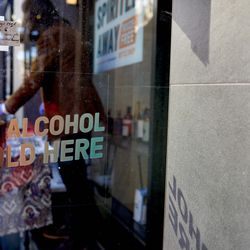 “No Alcohol Sold Here” signage is posted on the door at Spirited Away, an alcohol-free bottle shop, in the Lower East Side of Manhattan in New York on Saturday, March 13, 2021. The shop is devoted to everything needed to make alcohol-free cocktails.