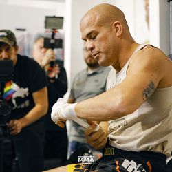 Tito Ortiz wraps his hands at the Liddell vs. Ortiz 3 open workouts at Kings MMA in West Hollywood, Calif.