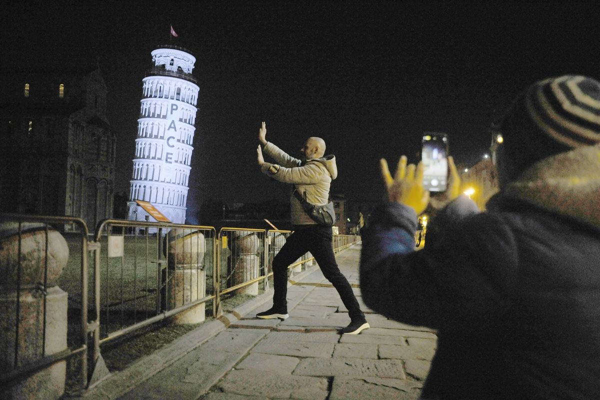 Tower of Pisa Is Illuminated With A Peace Protest Against The Invasion Of Ukraine
