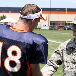 Peyton Manning meets with members of the United States Army after practice