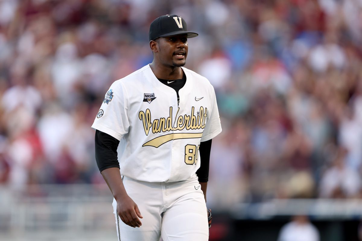 Starting pitcher Kumar Rocker #80 of the Vanderbilt reacts to being pulled from the game against Mississippi St. by Head Coach Tim Corbin of the Vanderbilt in the top of the fifth inning during game three of the College World Series Championship at TD Ameritrade Park Omaha on June 30, 2021 in Omaha, Nebraska.