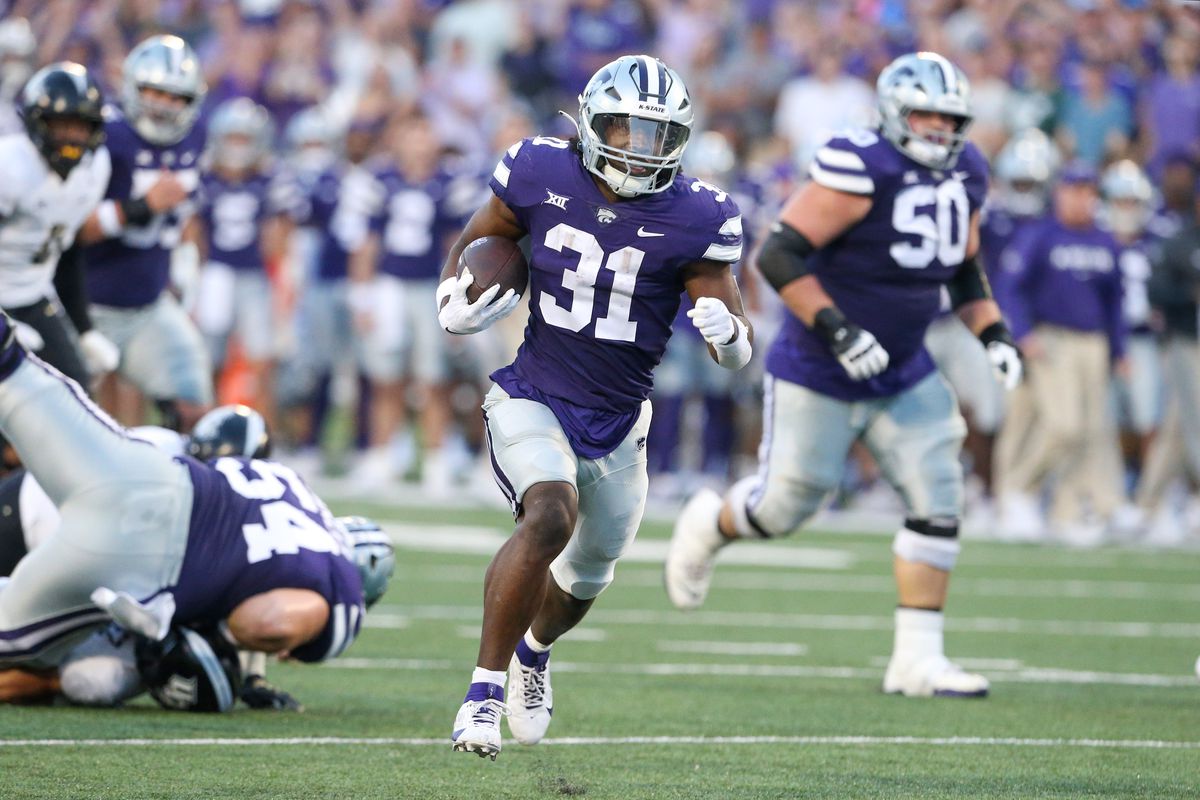Sep 23, 2023; Manhattan, Kansas, USA; Kansas State Wildcats running back DJ Giddens (31) breaks free for a big gain during the first quarter against the UCF Knights at Bill Snyder Family Football Stadium.