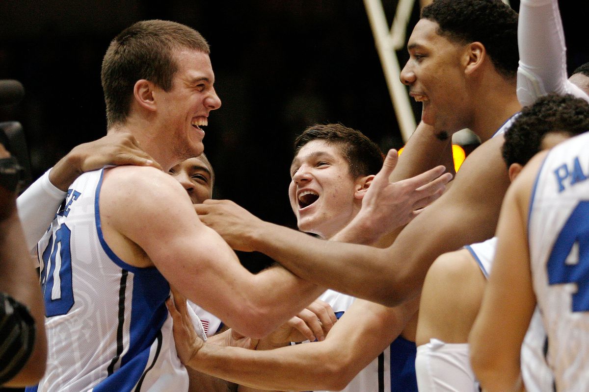 Nov 14, 2014; Durham, NC, USA; Duke Blue Devils center Marshall Plumlee (40) celebrates with teammates guard Grayson Allen (3) and center Jahlil Okafor (15) after Plumlee made a three point shot against the Presbyterian Blue Hose.