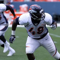 Broncos LBs Von Miller (L) and Shaquil Barrett (R) work on moving into coverage