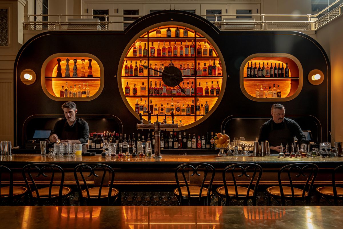 A bar that’s backlit and designed as a clock.