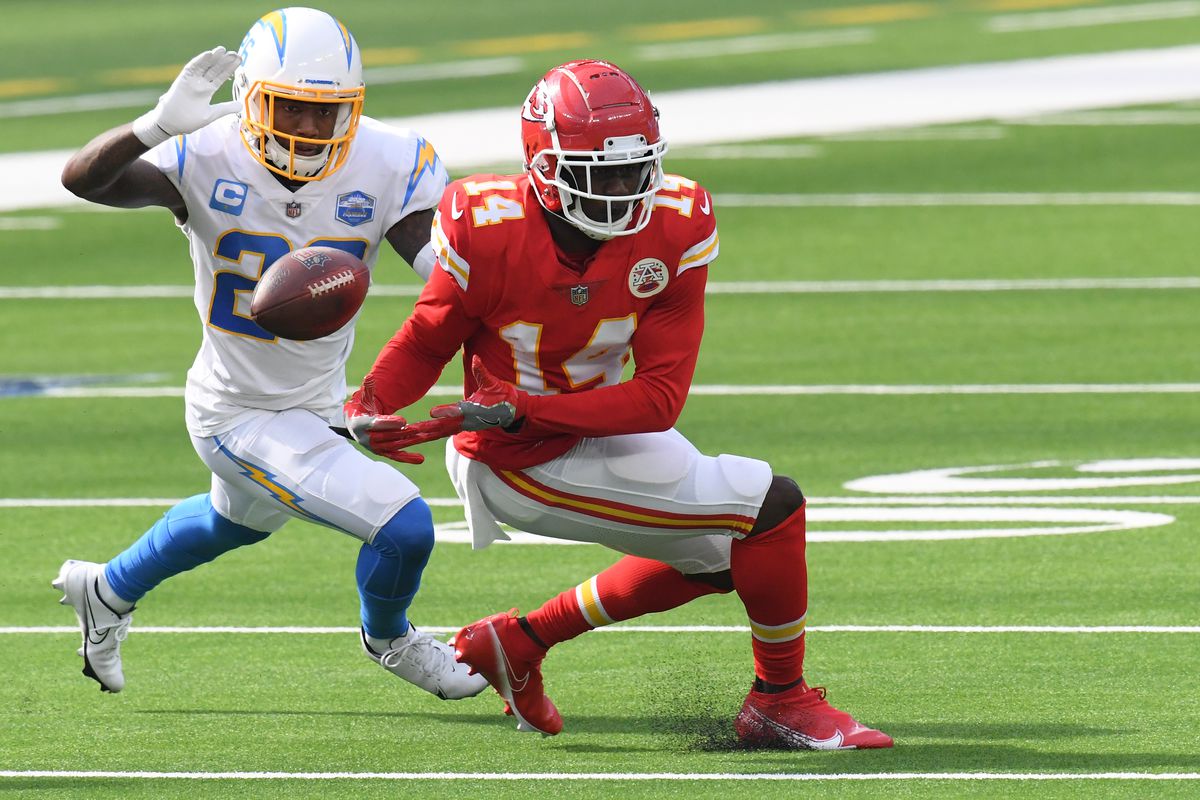 Wide receiver Sammy Watkins #14 of the Kansas City Chiefs drops a pass in front of cornerback Casey Hayward #26 of the Los Angeles Chargers during the third quarter at SoFi Stadium on September 20, 2020 in Inglewood, California.