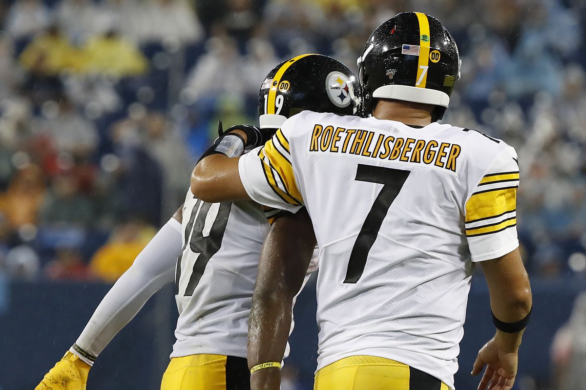 JuJu Smith-Schuster of the Pittsburgh Steelers is congratulated by teammate Ben Roethlisberger after catching a touchdown pass against the Tennessee Titans during the first half of a preseason game at Nissan Stadium on August 25, 2019 in Nashville, Tennes