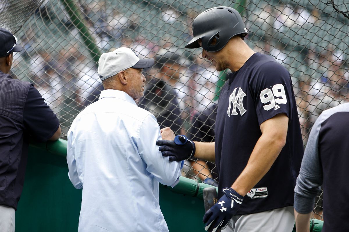 New York Yankees right fielder Aaron Judge talks with Hall of Famer Reggie Jackson during batting practice before a game against the Seattle Mariners at Safeco Field in July, 2017.