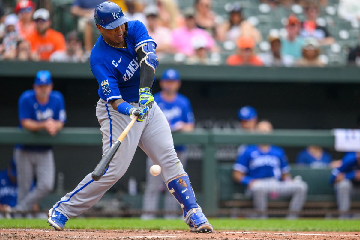 Jun 11, 2023; Baltimore, Maryland, USA; Kansas City Royals catcher Salvador Perez (13) hits a double during the first inning against the Baltimore Orioles at Oriole Park at Camden Yards.