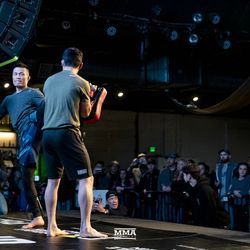 Chan Sung Jung kicks pads at the UFC Denver open workouts.