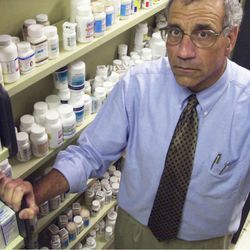 Dr. Harvey Siegal, director of Wright State University School of Medicine's Center for Interventions, Treatment and Addictions Research, stands in the campus pharmacy May 2, 2003, in Dayton, Ohio. Heroin is often cheaper and easier to obtain than prescription painkillers, Siegal said. That can lead to overdoses and exposure to hepatitis, HIV and other medical problems. (AP Photo/David Kohl)
