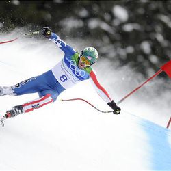 USA's Bode Miller clears a gate during his bronze medal run in the downhill. Switzerland's Didier Defago won gold, and Aksel Lund Svindal took silver.       