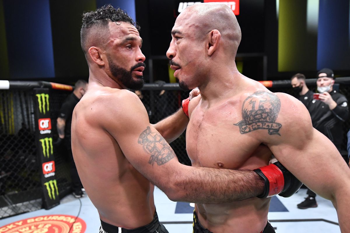 José Aldo and Rob Font embrace after their fight at UFC Vegas 44. 
