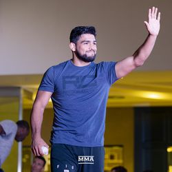 Kelvin Gastelum waves to the crowd at the UFC 224 open workouts Wednesday inside Barra Shopping Mall in Rio de Janeiro, Brazil.